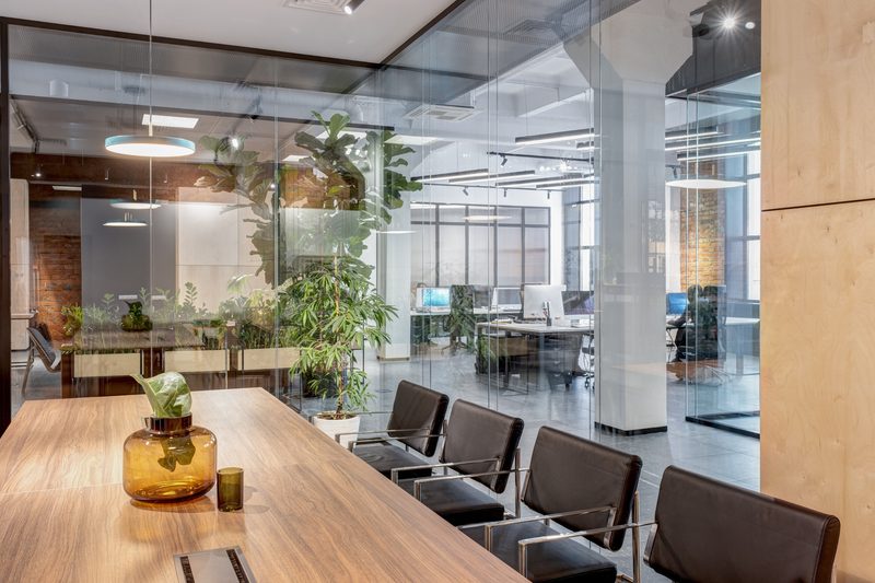 Brickworks + Loft glass-walled meeting room by Reschka Design Build