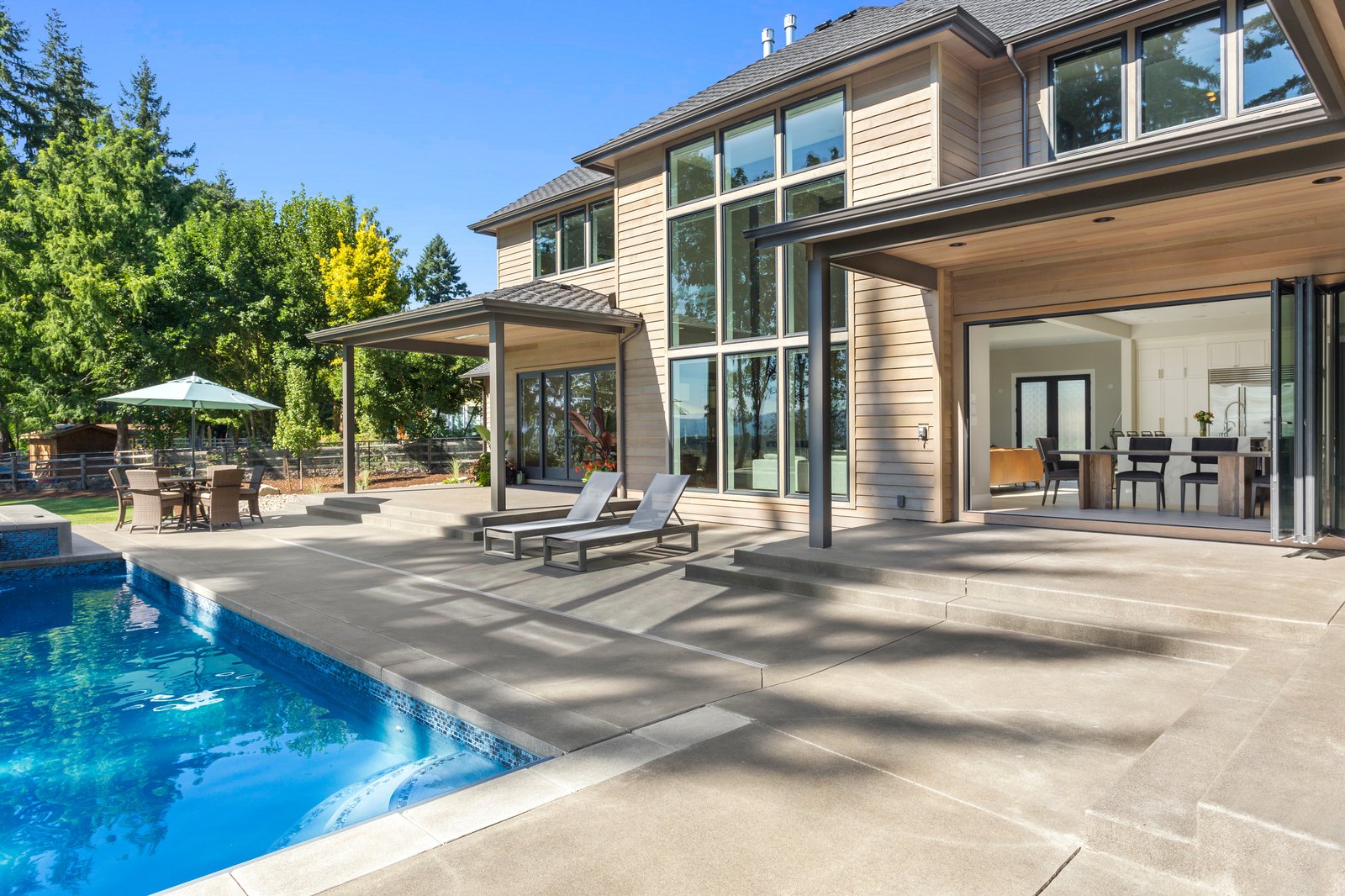 Forestview + Estate modern home pool deck by Reschka Design Build