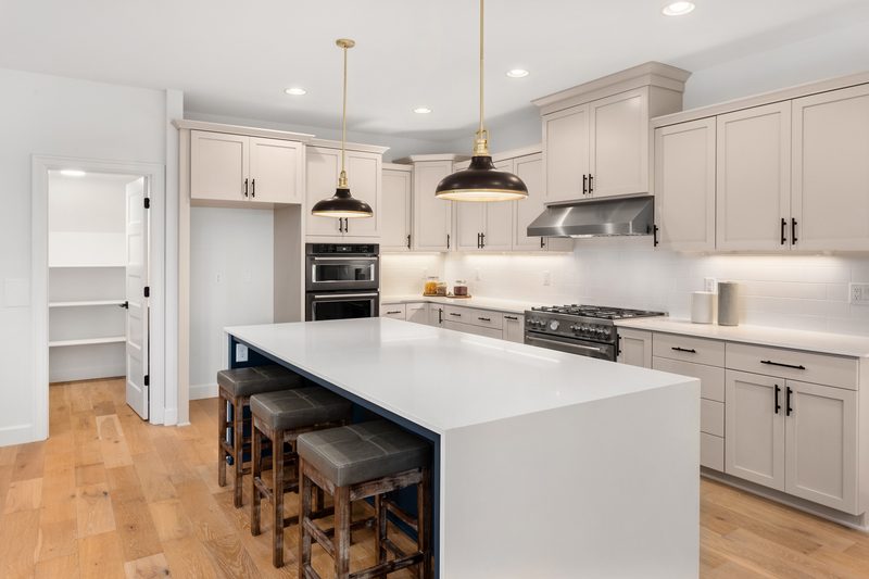 Sterling + Modern kitchen island custom home by Reschka Design Build