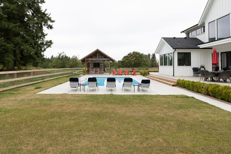 Willow Ridge + Estate pool house backyard view by Reschka Design Build